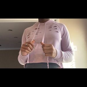 Pink distressed hoodie.